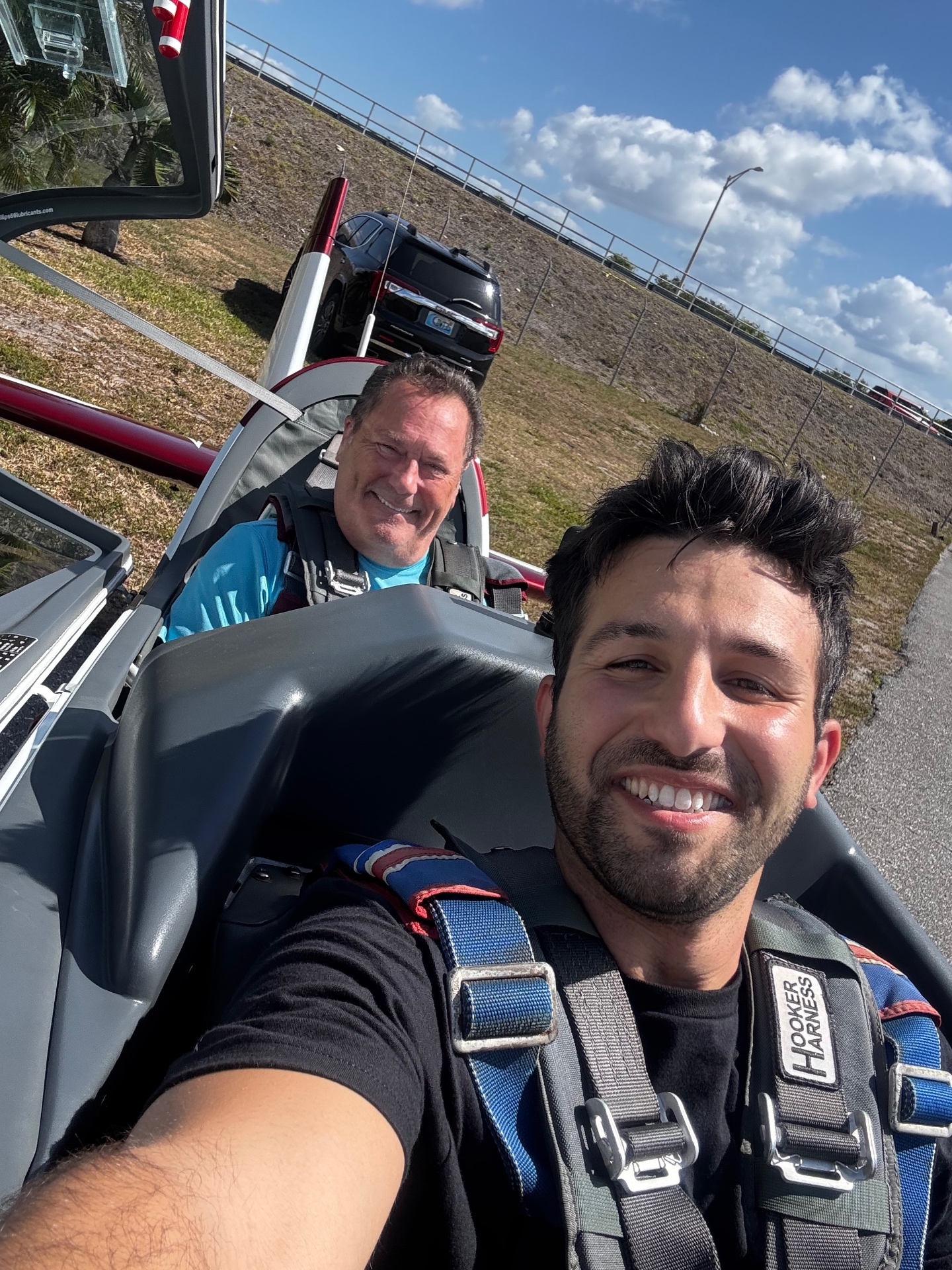 Gil Charnes with instructor in the Extra 330 cockpit